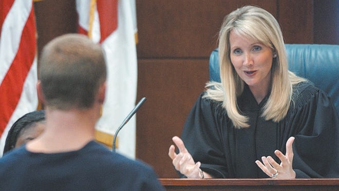 Circuit Court Judge Wendy Berger speaks with a participant in the St. Johns County Adult Drug Treatment Division's Drug Court on May 16, 2006. [JUSTIN YURKANIN/RECORD FILE]