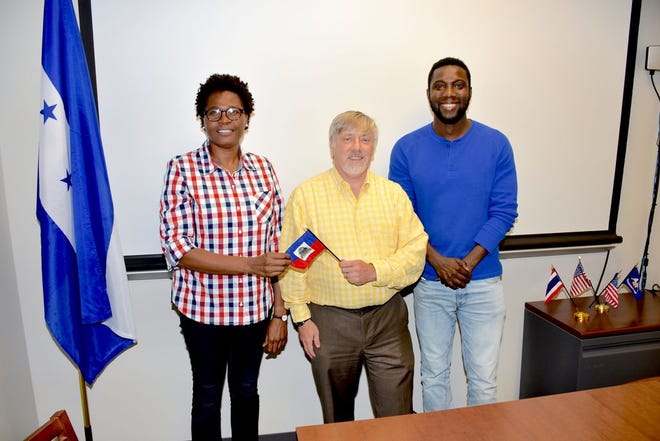 Haitian graduate students Jhonson Leonard and Marie Rachelle Lexidort share a moment with Jonathan Hubchen, assistant director of the LSU AgCenter Global Network. Both students will receive master’s degrees in agriculture from LSU in August through a United States Agency for International Development grant.
