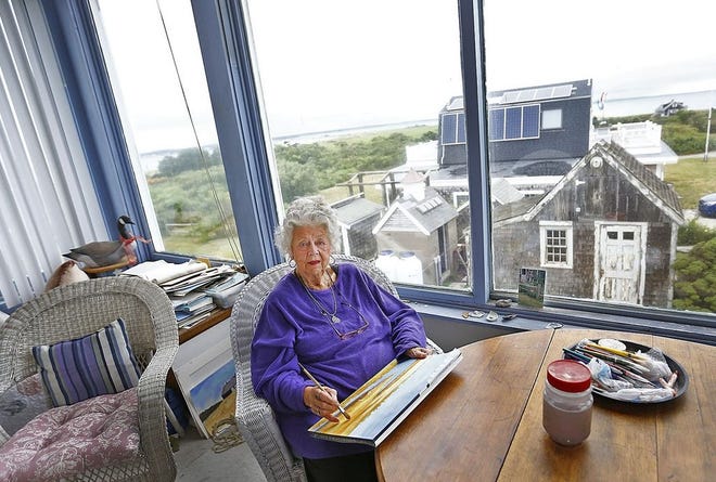 Elaine Nudd and her cat, Thai, at home on Gurnet Point in Duxbury on Tuesday, Aug. 8, 2017. Nudd has lived there for more than 50 years. At 89, she frequently paints scenes from close to home.