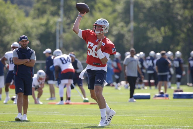 New England Patriots quarterback Jarrett Stidham passes the ball during an NFL football training camp practice, Thursday, July 25, 2019, in Foxborough, Mass.