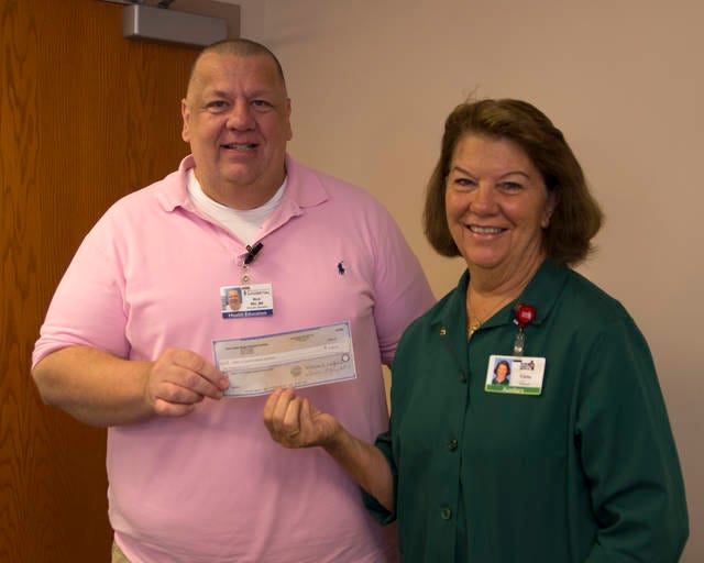 Presenting a check to Rick Petersen, EAP Chair, is Cathy Wetzeler, BCH Auxiliary President | Image contributed by Lisa Schmidt