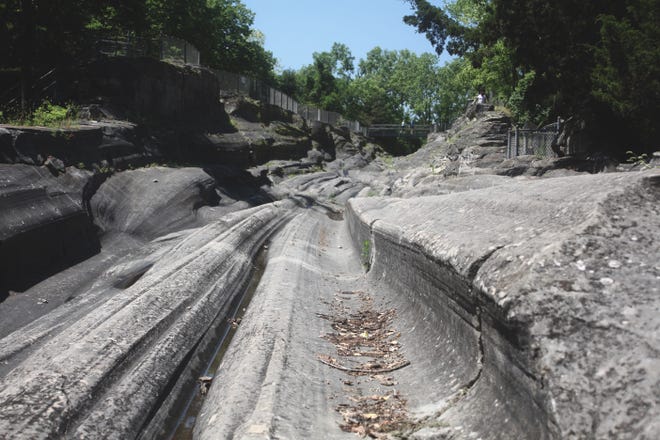 The glacial grooves on Kelleys Island once were covered with dirt and silt until being discovered in 1972. [Steve Stephens/Dispatch]