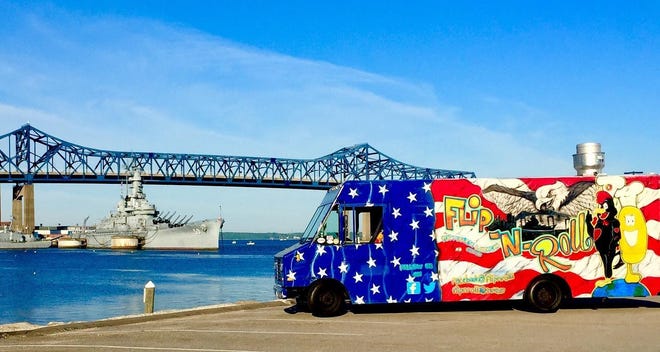 The Braga Bridge and Battleship Massachusetts, seen at left, adorn the Flip 'N Roll food truck owned by Fall River natives Bob "Scott" Cloutier and Joe Reis. [Courtesy photo]