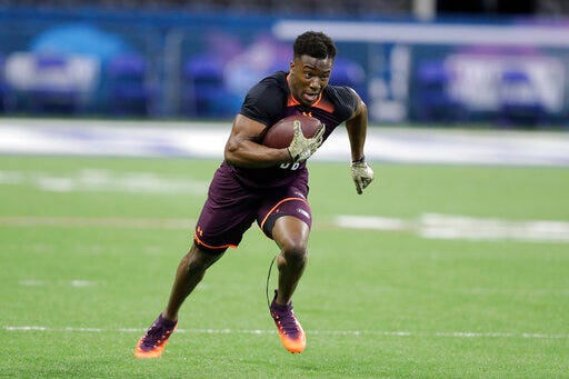FILE - In this March 4, 2019 file photo Washburn defensive back Corey Ballentine runs a drill during the NFL football scouting combine in Indianapolis. The New York Giants cornerback who was wounded hours after being drafted in an April shooting that claimed the life of his Washburn University teammate is trying to make a career in the NFL not only for himself but also his late best friend. "There have been a lot of highs and lows," Ballentine said Sunday, July 28, 2019 before the Giants finished their first week of training camp. (AP Photo/Darron Cummings, file)