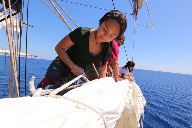 A teen secures a line aboard one of the tall ships participating in the Piscataqua Maritime Commission’s Sea Challenge, a program that provides scholarships for deserving teens to spend several days aboard a vessel at sea. [Courtesy photo]