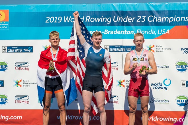 Samuel Melvin celebrates his hold medal in the Lightweight Men’s single at the U-23 World Rowing Championships on Sunday at Nathan Benderson Park. [Herald-Tribune Photo - Lisa Worthy]