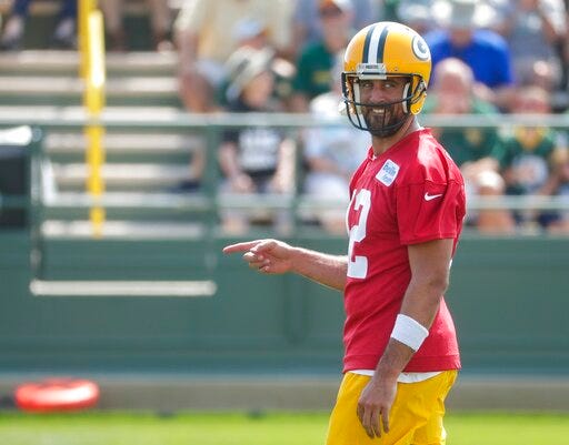 Green Bay Packers' Aaron Rodgers reacts during NFL football training camp Thursday, July 25, 2019, in Green Bay, Wis. (AP Photo/Morry Gash)