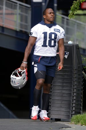 New England Patriots wide receiver Matthew Slater (18) steps on the field before the start of an NFL football training camp, Thursday, June 6, 2019, in Foxborough, Mass. (AP Photo/Steven Senne)