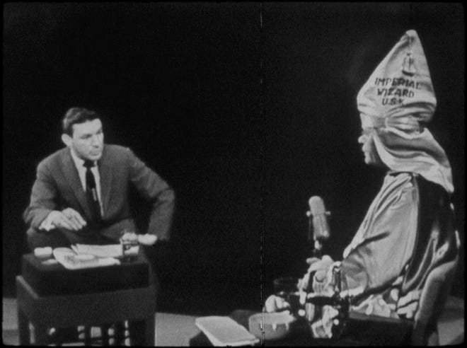 Mike Wallace, left, interviews Ku Klux Klan leader Eldon Edwards in a 1957 episode of the TV program “The Mike Wallace Interview.” MUST CREDIT: Handout photo by Magnolia Pictures
