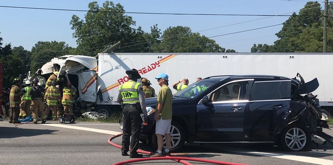 Crews investigate a wreck Monday morning that shut down part of eastbound U.S. 74 at the intersection of Westlee Street near Lattimore. [Joyce Orlando/The Star]