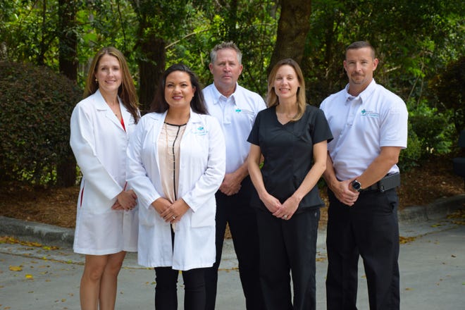 The NHRMC Transitional Care Clinic team includes a physician, a pharmacist, a case manager, a medical assistant and community paramedics. [PHOTO COURTESY OF NHRMC]