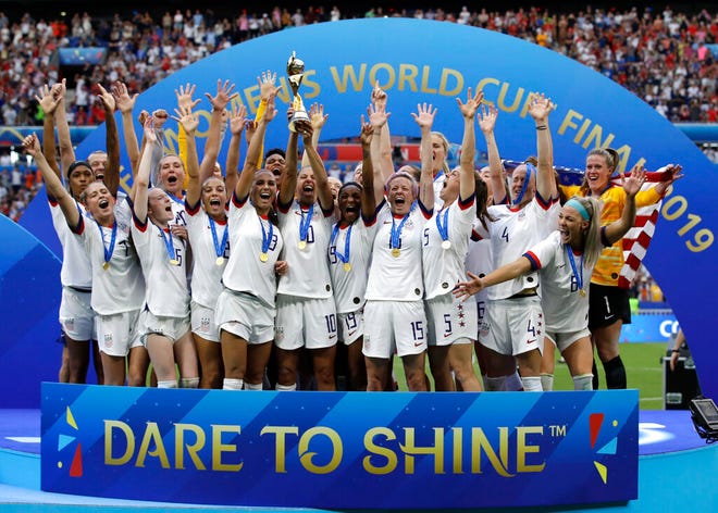 The United States team celebrates with the trophy after winning the Women's World Cup final soccer match between US and The Netherlands at the Stade de Lyon in Decines, outside Lyon, France. U.S. Soccer says the players on the World Cup champion women's national team were paid more than their male counterparts from 2010 through 2018. According to a letter released Monday, July 29, 2019 by U.S. Soccer President Carlos Cordeiro, the federation has paid out $34.1 million in salary and game bonuses to the women as opposed to $26.4 million paid to the men. Those figures do not include the benefits received only by the women, like health care. (AP Photo/Alessandra Tarantino, file)