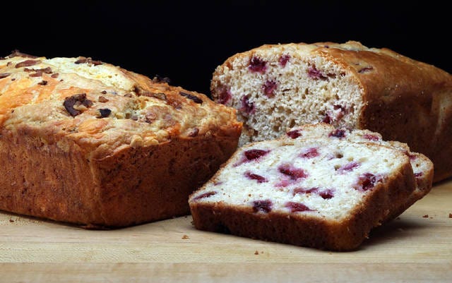 Two summer quick breads: Left, with bacon and cheese, and, right, with cherries and almonds. (Terrence Antonio James / Chicago Tribune / TNS)