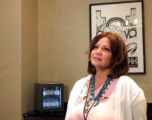 Pamela Foster speaks to reporters on Tuesday, July 30, 2019, at Isleta Pueblo, N.M., where a training session is being held for tribes to implement their own Amber Alert systems. Foster's daughter Ashlynne Mike was 11 when she was kidnapped and killed in May 2016 after school near her home on the Navajo Nation. An Amber Alert wasn't issued for her until early the next morning. (AP Photo/Mary Hudetz)
