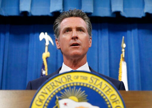 This July 23, 2019 photo shows California Gov. Gavin Newsom during a news conference in Sacramento, Calif. Newsom signed a law Tuesday, July 30, requiring presidential candidates to release their tax returns to appear on the state's primary ballot, a move aimed squarely at Republican President Donald Trump. (AP Photo/Rich Pedroncelli)