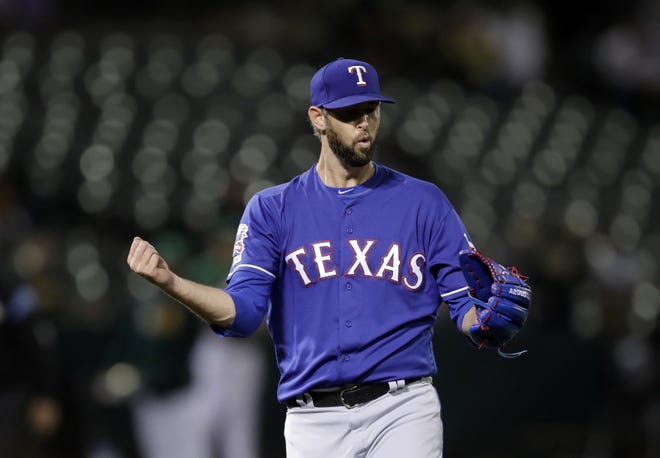 Texas Rangers pitcher Chris Martin celebrates the 5-2 win as the final out is made against the Oakland Athletics in the ninth inning of a baseball game Friday, July 26, 2019, in Oakland, Calif. (AP Photo/Ben Margot)