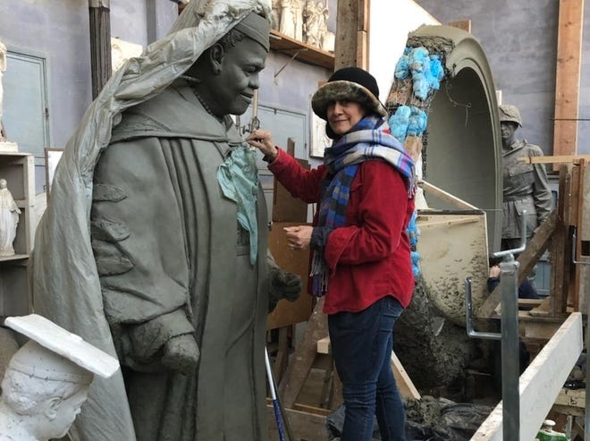 Florida artist Nilda Comas works on a clay version of the statue she was commissioned to create of B-CU founder Mary McLeod Bethune, which will stand in Statuary Hall in Washington next year. [Courtesy photo]