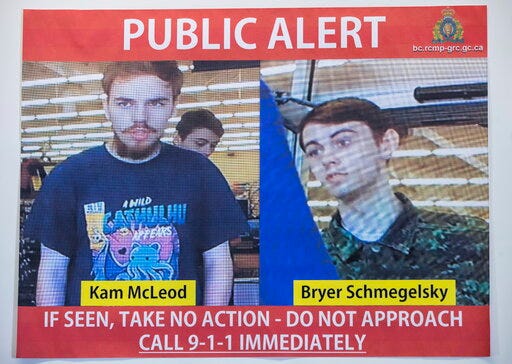Security camera images of Kam McLeod, 19, and Bryer Schmegelsky, 18, are displayed during a news conference in Surrey, British Columbia, Tuesday, July 23, 2019. The two young men, thought to be missing, are now suspects in the murders of an American woman and her Australian boyfriend as well as the death of another man in northern British Columbia, Canadian police said Tuesday. (Darryl Dyck/The Canadian Press via AP)