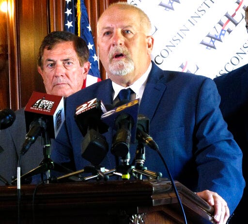 Conservative attorney Rick Esenberg details a new lawsuit asking the Wisconsin Supreme Court to overturn four partial vetoes made by Democratic Gov. Tony Evers and limit the ability of future governors to make similar vetoes during a news conference at the Statehouse in Madison, Wis., Wednesday, July 31, 2019. If successful, the move would reverse more than four decades of precedent. (AP Photo/Scott Bauer)