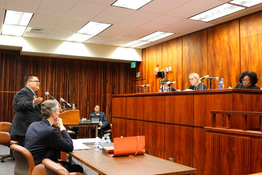 FILE - In this Oct. 10, 2018 file photo, a panel of 9th U.S. Circuit Court of Appeals judges in Honolulu listen to arguments about non-native residents of Guam having a say about the territory's future relationship with the United States. On Monday, July 29, 2019, the court upheld a 2017 ruling that said it's unconstitutional to limit an advisory vote to those who are considered native inhabitants of Guam. The U.S. territory's non-binding election would have given native Chamorro residents three choices: independence, statehood or free association with the U.S. (AP Photo/Jennifer Sinco Kelleher, File)