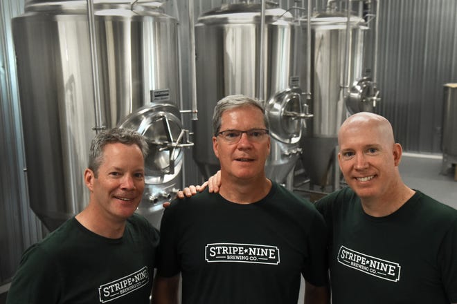 Three brothers, Tom, left, Patrick, center, and Sean Kelly are getting ready to open Stripe Nine Brewing Co. at 8 Somersworth Plaza, formerly the Old Care Pharmacy. 

[Deb Cram/Fosters.com]