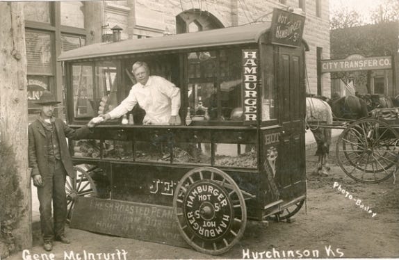 Shown in 1908, Gene McInturff sold hamburgers and hotdogs from his mobile wagon. [Conard - Harmon Collection]