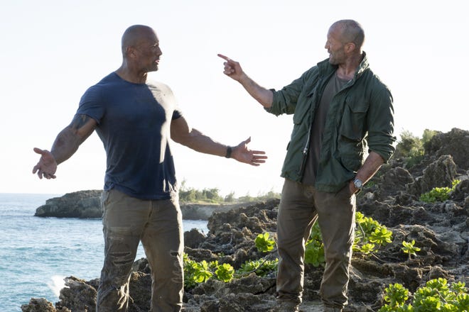 Luke Hobbs (Dwayne Johnson, left) and Deckard Shaw (Jason Statham) in "Fast & Furious Presents: Hobbs & Shaw," directed by David Leitch.

(Photo Credit: Frank Masi/Universal Pictures)