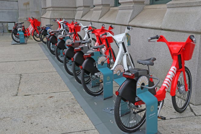 JUMP bikes are racked in front of Providence City Hall. [The Providence Journal, file / Sandor Bodo]