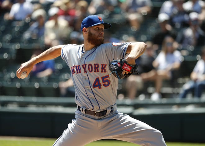 New York Mets starting pitcher Zack Wheeler delivers during the first inning of his team's 4-0 victory over the White Sox on Thursday in Chicago. [CHARLES REX ARBOGAST/THE ASSOCIATED PRESS]