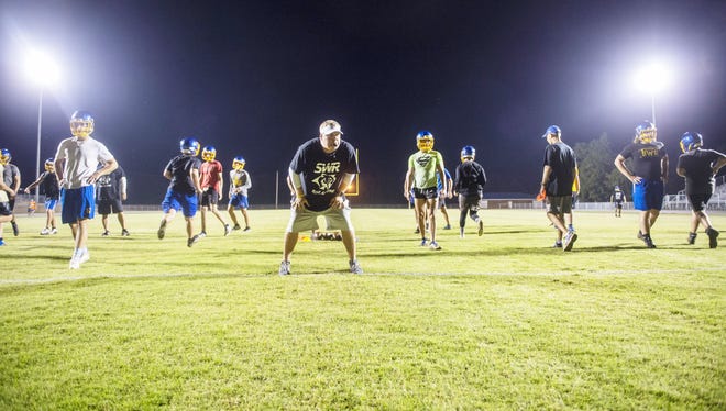 Southwestern Randolph's head coach Seth Baxter, front, runs drills during the Cougars' Midnight Madness Thursday morning. [PJ WARD-BROWN/SPECIAL TO THE COURIER-TRIBUNE]