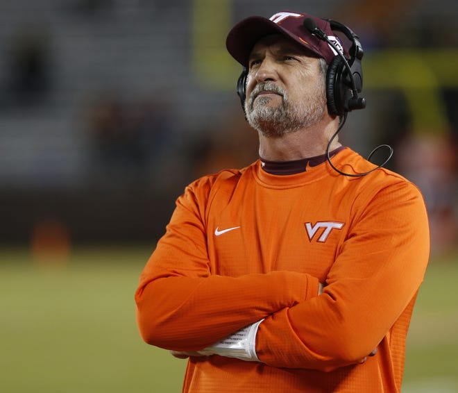 Virginia Tech defensive coordinator Bud Foster looks at the scoreboard during the second half of a 2018 football game against Georgia Tech. Foster, a Nokomis High School graduate, announced Thursday this will be his 33rd and final season as an assistant coach for the Hokies. [STEVE HELBER/THE ASSOCIATED PRESS]