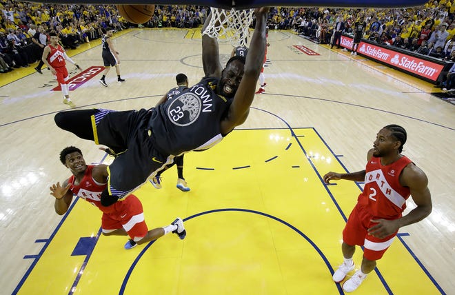 Golden State Warriors forward Draymond Green (23) throwns down a dunk during a June 13 game in the NBA Finals against the Toronto Raptors. [AP Photo/Tony Avelar]