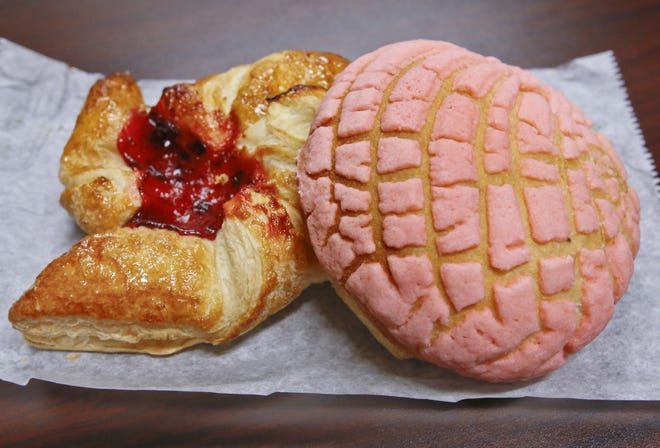 La Michoacana Bakery, 2410 S.E. 6th Ave., sells several Mexican bakery items, including a strawberry-filled pastry, left, and conchitas—a Mexican sweet bread roll—right. [Chris Neal/The Capital-Journal]