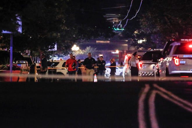 Authorities work the scene of a mass shooting, Sunday, Aug. 4, 2019, in Dayton, Ohio. A several people in Ohio have been killed in the second mass shooting in the U.S. in less than 24 hours, and the suspected shooter is also deceased, police said.