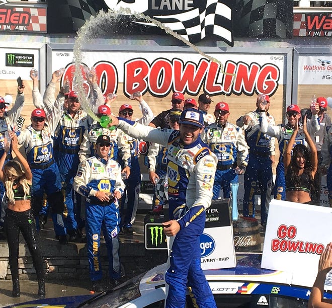 Chase Elliott sprays his team following his second straight NASCAR win at Watkins Glen International Sunday in the Go Bowling at The Glen. [SHAWN VARGO/THE LEADER]
