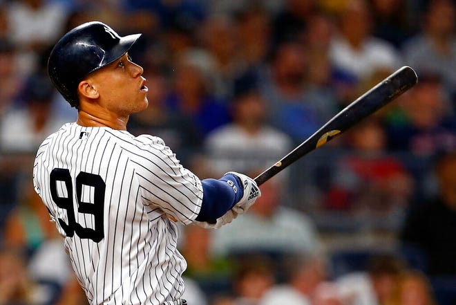 New York Yankees designated hitter Aaron Judge watches his solo home run during the first inning of a baseball game against the Boston Red Sox, Sunday, Aug. 4, 2019, in New York. (AP Photo/Adam Hunger)