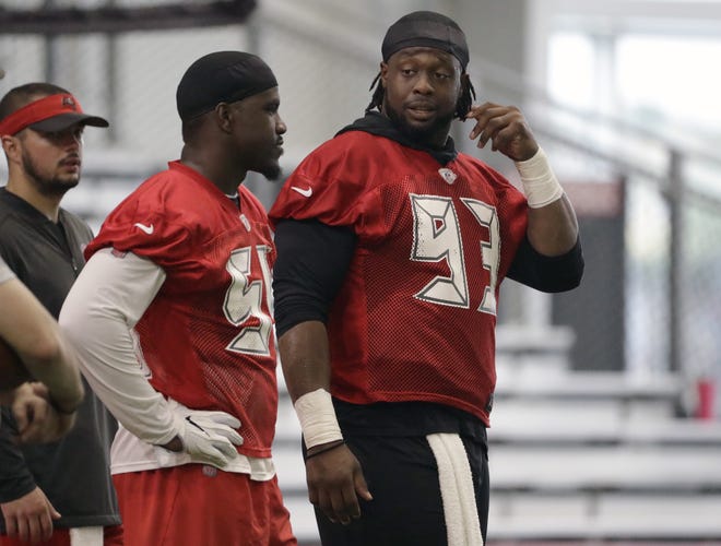 Tampa Bay Buccaneers linebacker Lavonte David had surgical procedure to repair a meniscus tear recently but is exepected to start in the season opener Sept. 8 against San Franciso. Above: defensive tackle Gerald McCoy (93) talks to David during an NFL football training camp practice on July 26, 2018, in Tampa. CHRIS O'MEARA/THE ASSOCIATED PRESS