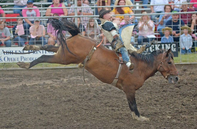 Ty Blessing, of Pomona, scores an 83.50 in the bareback riding competition on the second night of the Wild Bill Hickok Rodeo in Abilene. [Aaron Anders/SALINA JOURNAL]