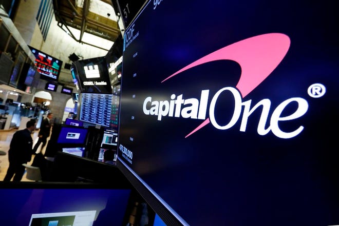 In this July 30 file photo, the logo for Capital One Financial appears above a trading post on the floor of the New York Stock Exchange. Data breaches through hacking attacks are common these days, and personal details about you can lead to identity theft, such as credit cards and loans in your name. Yet few victims can ever pin the blame on any specific breach, whether that’s Equifax from 2017 or the recently disclosed breach at Capital One. (AP Photo/Richard Drew, File)