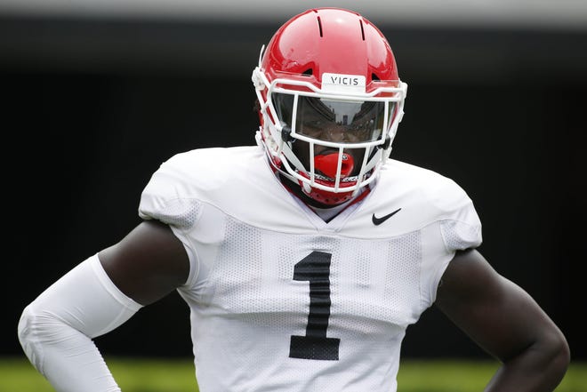 Georgia outside linebacker Brenton Cox looks on during warm-ups before a spring practice. [JOSHUA L. JONES/ATHENS BANNER-HERALD]