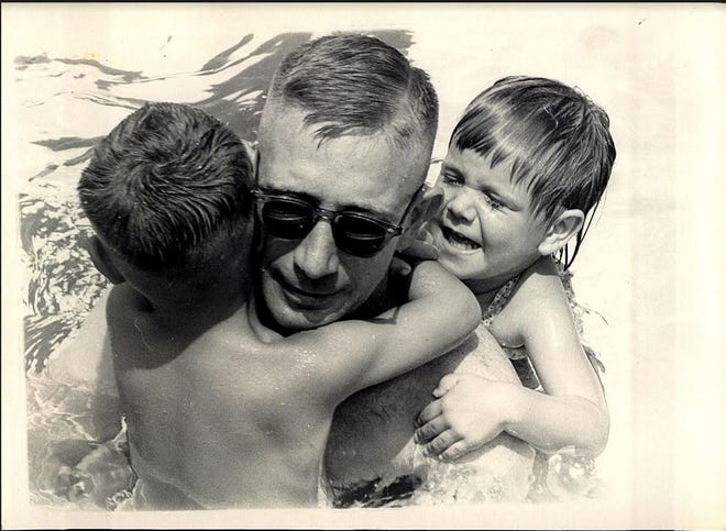 Army Capt. George Hodgson was about to be reassigned from the University of Alabama Army ROTC Program to serve a tour in Vietnam. He is pictured with his 4-year-old son, Peter, and 3-year-old daughter, Debbie, at the UA outdoor pool. George graduated from UA in 1960 and with a master's degree in 1969. He was commissioned through the UA Army ROTC Program in January 1961. After serving 26 years in the active U.S. Army, George retired as a colonel. After retirement, George returned to live in Tuscaloosa in 2000. 

Peter grew up to attend UA, graduating in 1986 and getting a commission from the UA Army ROTC Program. He returned to the university and has been working in the College of Continuing Studies since 1997.

Debbie grew up to attend UA, graduating in 1987 and 1988 with a master's degree. After working at Bryce Hospital for a number of years, she now works at Walter Reed Military Hospital. Deborah earned bachelor's and master's degrees in social work from UA in 1986 and 1990, respectively.

Comments? Reach bettyslowe6@gmail.com or call 205-722-0199. [Photo submitted by George Hodgson]