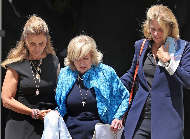 Courtney Kennedy Hill helped down the steps by by Maria Shriver, left, and Sydney Lawford McKelvy, right, at the funeral services for her daughter Saoirse Kennedy Hill at Our Lady of Victory Church in Centerville, Mass., Monday, Aug. 5, 2019. (David L Ryan/The Boston Globe via AP, Pool)