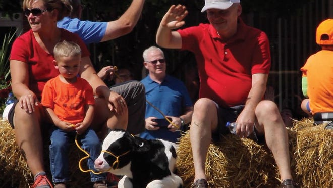 Preston Family Farm of Quincy included a newborn calf on its float. Members of the Preston family walked through the crowd inviting the public their annual farm tour and ice cream social from 1-4 p.m. on Aug. 31.