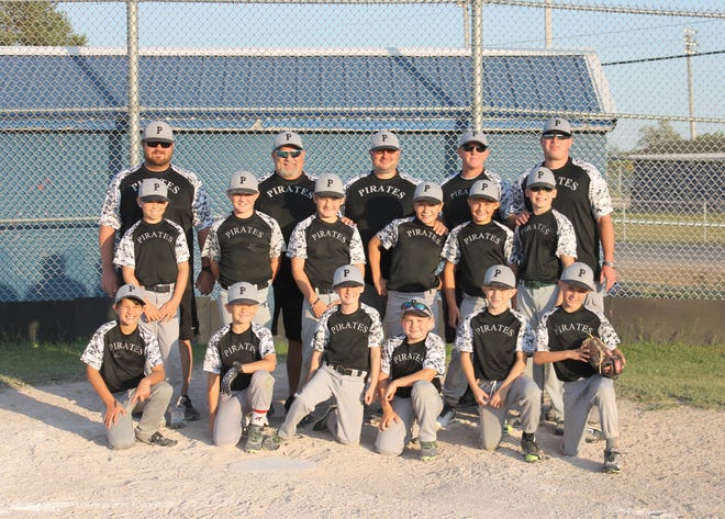The Pickford Pirates captured the Minors Division Championship and were also undefeated this Little League season. Pictured, from left to right, are: (front row) Troy McCord, Billy Barber, Jacob Mitchell, Evan Maciag, Kane Savoie, Dalton Savoie; (middle row) Liam MacDonald, Carter Rye, Mason Andrzejak, Jonas Rivers, Owen Campbell, Caden Chromy; (back row) Coaches Davis Rye, Stan Suchey, Jason Fegan, Tobey Mitchell, and Marc Andrzejak. (Courtesy of Brooke Maciag)
