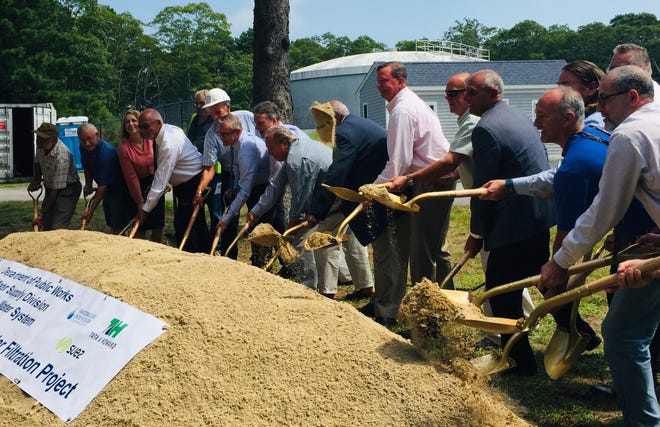 State and local leaders break ground Wednesday on a new $12 million water treatment building at the Maher Well field in Barnstable. [BP PHOTOS BY BRONWEN HOWELLS WALSH]