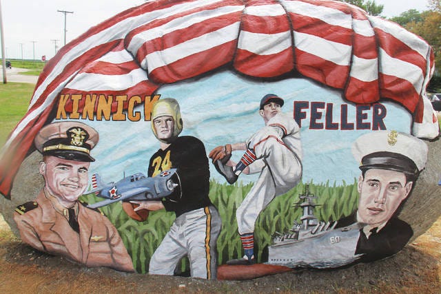 The back side of the Dallas County Freedom Rock features veterans and professional legendary athletes Nile Kinnick and Bob Feller.