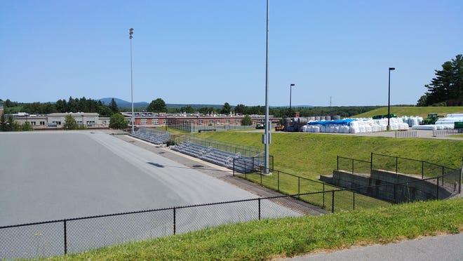 During the last week of July, rolls of artificial turf can be seen waiting to be set down on the field at Wachusett Regional High School. [Patricia Roy photo]