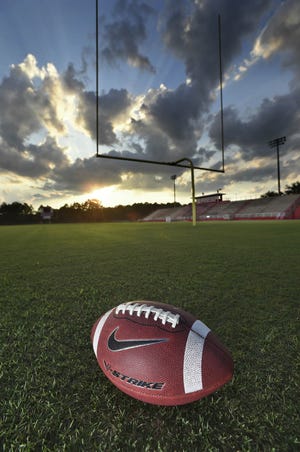 The sun sets over Jack Foster Stadium on the Crestview High School campus Tuesday eveing. [DEVON RAVINE/DAILY NEWS]