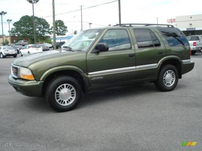 DeKalb County investigators are looking for a suspect in conection with an assault and robbery at a produce stand. The suspect's vehicle was possibly a green GMC Jimmy, like the one pictured here, or a Chevrolet Trailblazer. [Provided photo]