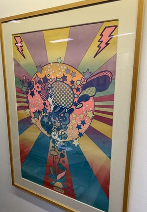 A poster by Peter Max will be raffled to help raise funds for ReTree PC. [TONY SIMMONS/THE NEWS HERALD]
